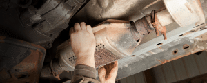 Mechanic working on an exhaust system